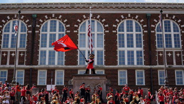 Sep 14, 2019; Cincinnati, OH, USA; The Cincinnati Bearcats mascot waves a team flag in the game against the Miami (Oh) Redhawks in the first half at Nippert Stadium. Mandatory Credit: Aaron Doster-USA TODAY Sports